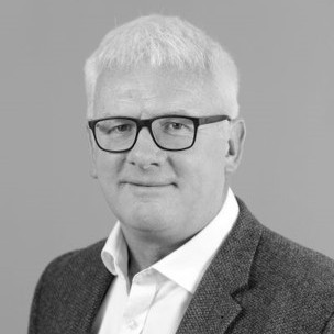 Headshot of Dr. Alan Lowdon OBE